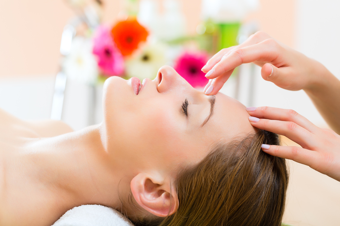 Woman Getting Head Massage in Spa